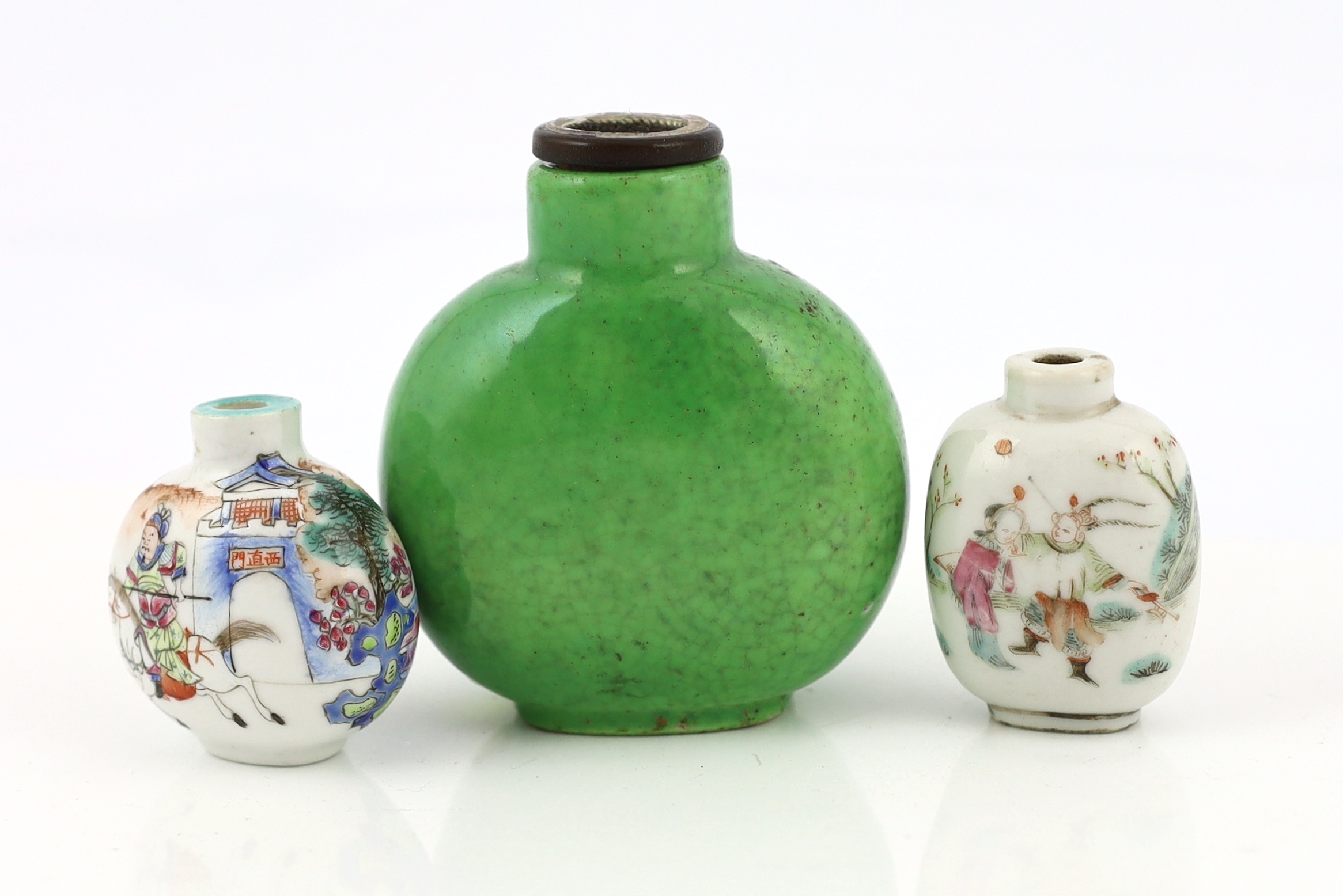 A large Chinese green crackle glazed snuff bottle, Daoguang mark and period, and three other 19th century porcelain snuff bottles